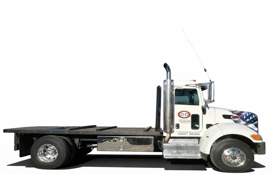 D&D Peterbilt flatbed hauling crated freight